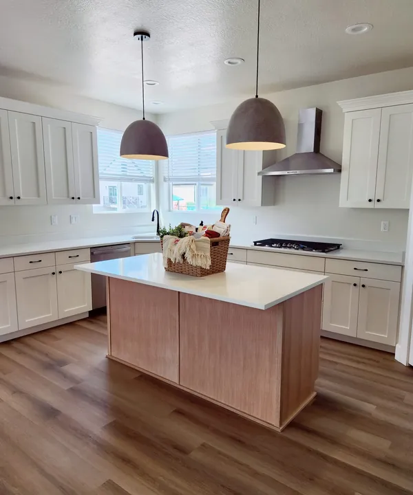 A clean kitchen and open living space